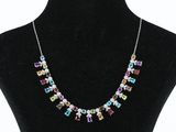 a necklace made of multicolored glass beads on a mannequin