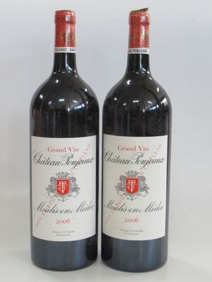 two bottles of red wine sitting next to each other on a table