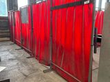 a room that has a red curtain in the middle of it
