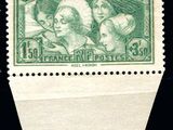 a green stamp with a picture of two women on it