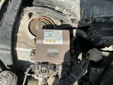 a close up of a car ' s engine and its wiring