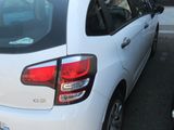 a white car that is parked in a parking lot