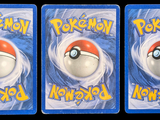 three cards with a picture of a pokemon figure on them