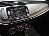 the dashboard of a car with a radio and a steering wheel