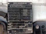 a close up of a motorcycle engine with a sign on it