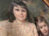 a painting of two children in a picture frame