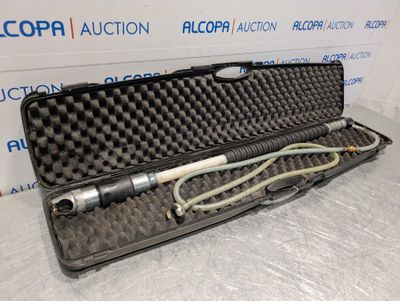an open case with a microphone in it sitting on a table