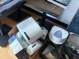 a pile of electronics sitting on the floor in a room
