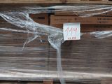 a large stack of boxes with plastic wrap on them