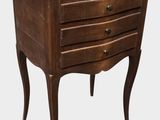 an image of a wooden table with drawers on it