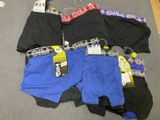 several pairs of men ' s underwear are laid out on the floor