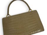 a brown crocodile skin purse on a white background
