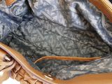 the inside of a handbag with a zipper on the inside