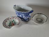 three bowls and a bowl sitting on a table