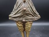 an image of a statue of a man with a hat and cape