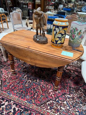 a table that has a vase on top of it
