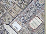 a rug on the floor with a tag on it