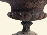 a large stone bowl with a bird on it