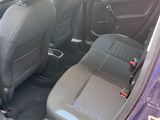 a purple car with black seats in the back of it