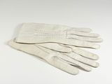an image of a pair of white leather gloves on a white surface