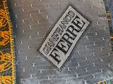 a close up of a tie with a label on it