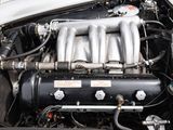 a close up of a car ' s engine with its hood open