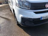 a white van that is parked on the side of the road