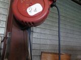 a red hose attached to the side of a building