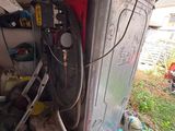 an image of a garage with a washing machine and tools