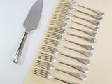 a lot of forks and a knife on the table