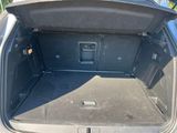 a trunk of a car with a speaker in it