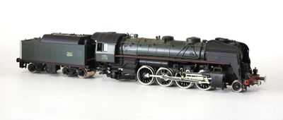 a toy train on a white surface with a white background