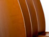 a brown leather couch that is sitting in a room