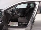 a silver car with its door open and the driver ' s seat down