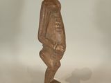 statue of a man with a hat on his head on a marble base