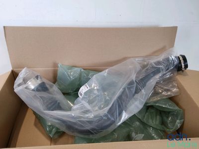 a box with a bunch of green items inside of it