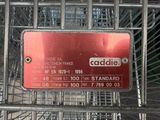 a red sign that is on the side of a shopping cart
