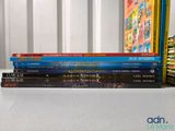 several children ' s books stacked on top of each other on a table
