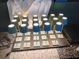 a table with a bunch of lamps on top of it