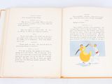 an open book with a picture of a woman and two children on it