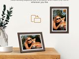 a picture of a woman holding a dog and a picture of a cat on a table