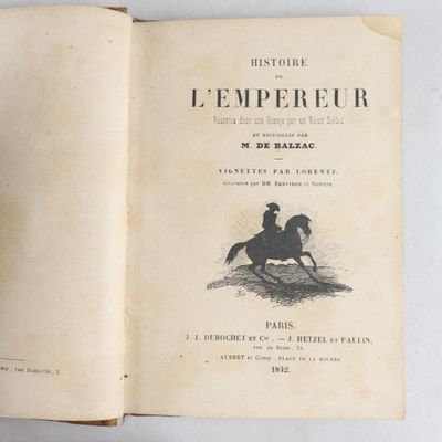 an open book with a drawing of a man riding a horse