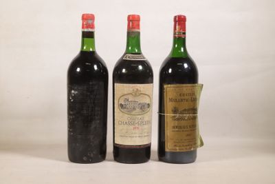 trois bouteilles de vin sont alignées sur une surface blanche