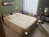 a bedroom with a bed and a desk in it