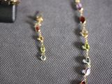 necklace and earring set with multi colored stones and gold chain