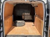 a white van with a flat bed in the back of it