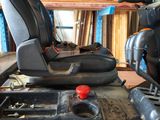 a picture of a tractor seat in a garage