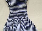 a blue and white striped dress on a white background