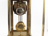 a clock that is inside of a glass case