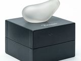 a white object sitting on top of a black box